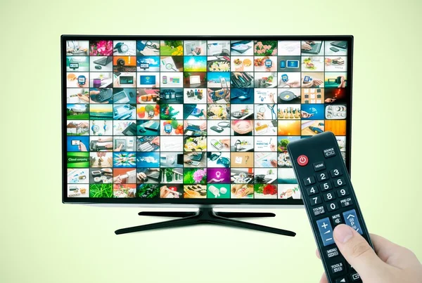 Widescreen high definition TV screen with video gallery. Remote — Stock Photo, Image