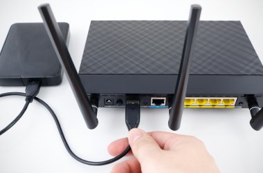 Router with backup storage disk. DLNA media server from USB disk clipart