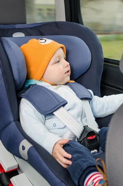 Cute boy sitting in the car seat — Stock Photo, Image