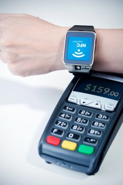 Man using smart watch with NFC chip. Fast contactless payment 