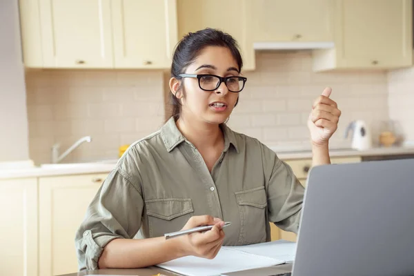 Indian woman online school teacher explaining online class video call.