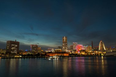 Cityscape of Minato Mirai in Yokohama City, Kanagawa Prefecture, Japan with harbor for tourist during sunset