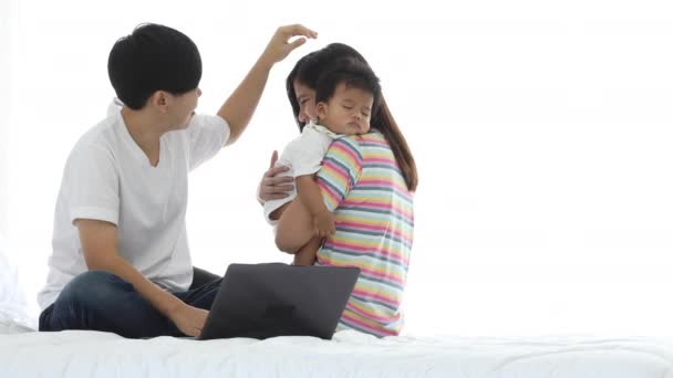 Elder Woman Touch Head Younger Couple Sleeping Baby While Using — Stock Video