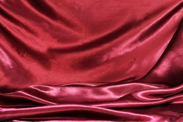 어두운 빨간색 실크 직물의 물결 주름 — 스톡 사진