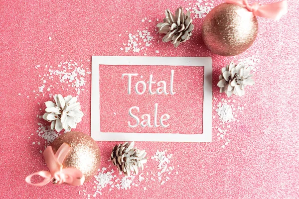 Christmas sale with baubles on pink glitter background. Chritmas sale concept