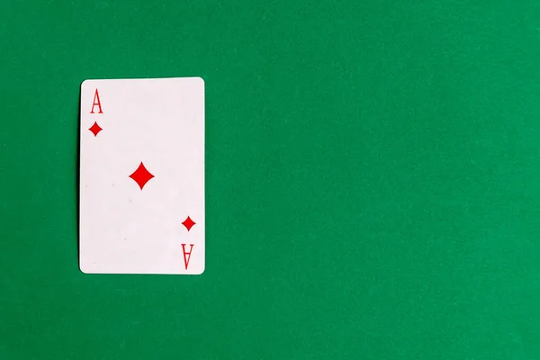 Ace Diamonds Playing Card Green Background Top View Copy Space — Zdjęcie stockowe