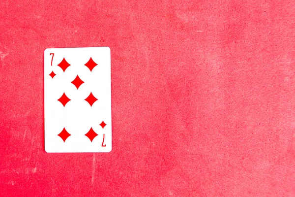 Seven Diamonds Playing Card Red Background Top View — Foto de Stock