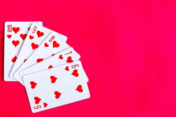 Poker Straight Flush Playing Card Top View Red Background — Zdjęcie stockowe