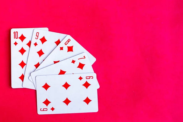 Poker Straight Flush Playing Card Top View Red Background — Stockfoto