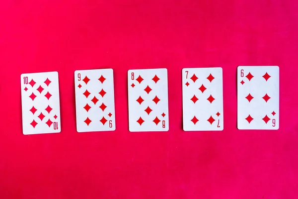 Poker Straight Flush Playing Card Top View Red Background — Stok fotoğraf