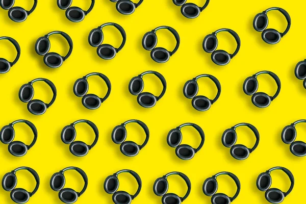 Modern Black Headphones Pattern Isolated Bright Yellow Background Copy Space — 图库照片