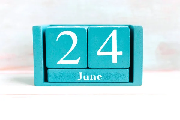 June 24. Blue cube calendar with month date isolated on white background.