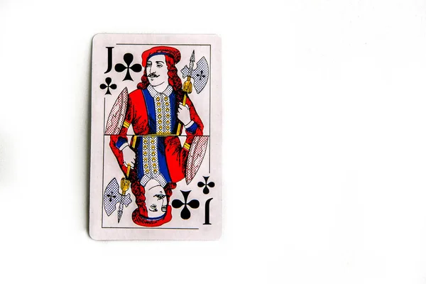 Joker of diamonds playing card, wooden background, copy space