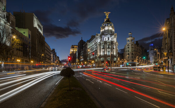 Madrid, Spain February 1th, 2014: night trail light in Gran Via street, one of the most famous places in Madrid, at twilight time, february 1th, 2014
