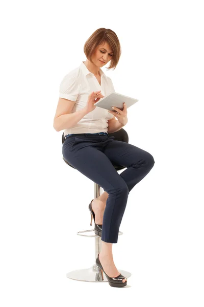 Businesswoman using tablet while sitting on chair — Stock Photo, Image