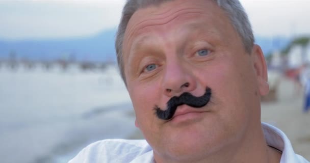 Senior man with fake mustache — Stock Video