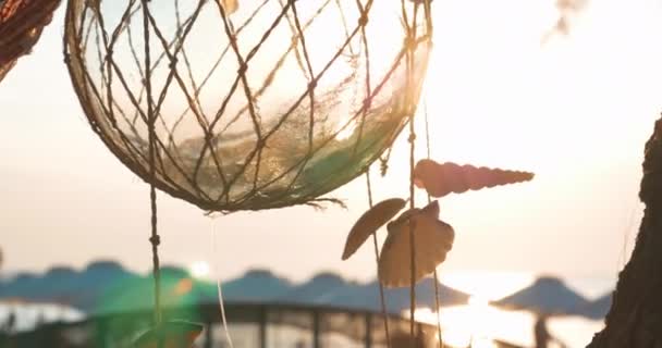 Decorative globe with shells jingling in the wind — Stock Video