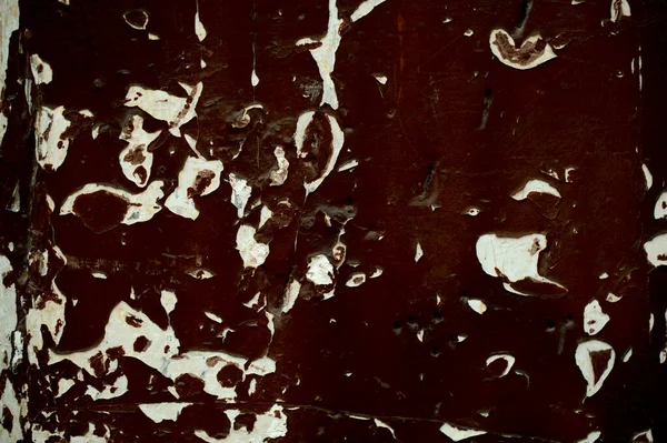 Old wooden panel with grungy peeling dark paint — Stock Photo, Image
