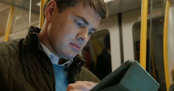 Man Using Tablet PC in Metro Train — Stock Photo, Image