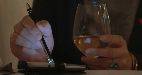 Woman having wine and using cell phone — Stock Photo, Image