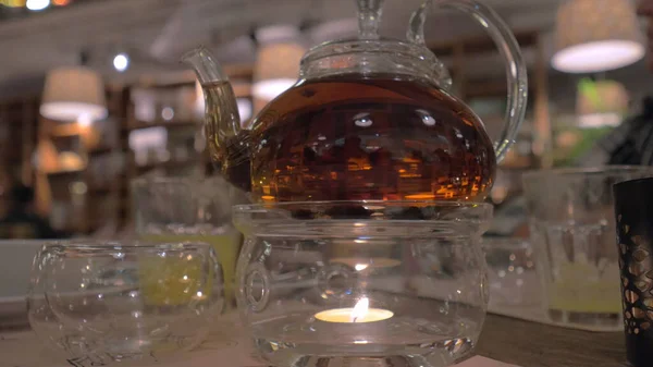 Glass teapot on the table in restaurant — Stock Photo, Image