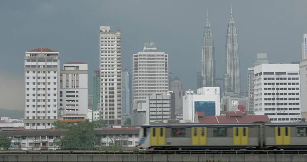 View of train on the foreground and modern buildings skyscraper on the background Kuala Lumpur, Malaysia — Stock Photo, Image