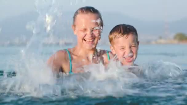 Little Son And Mother Fooling In Water — Stock Video