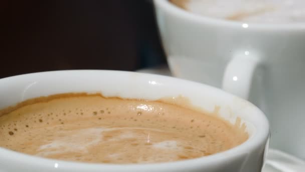 Putting  sugar into cup with coffee — Stock Video