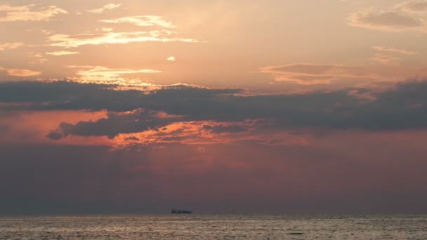 Sunset over sea and sailing ship — Stock Video