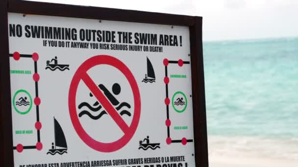 Warning board with restrictions on the beach — Stock Video