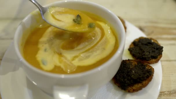 Stirring cream soup with spoon. Tasty dinner in cafe — Stock Footage Stirring cream soup with spoon. Tasty dinner in cafe Video Clip