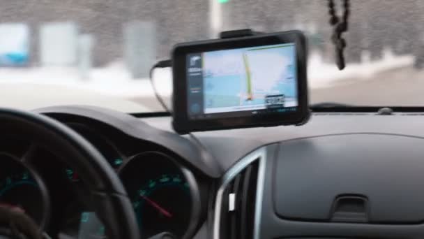 Driving a car with GPS device over dashboard — Stock Video