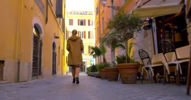 Woman in the street using pad to make photo or video — Stockvideo