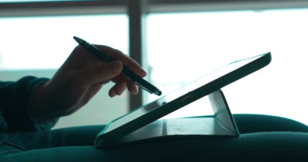 Woman using pen to work with touch pad — Stock Video