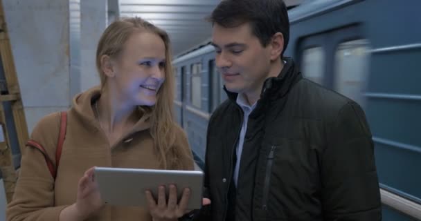 Young people with tablet computer in subway — Stok video