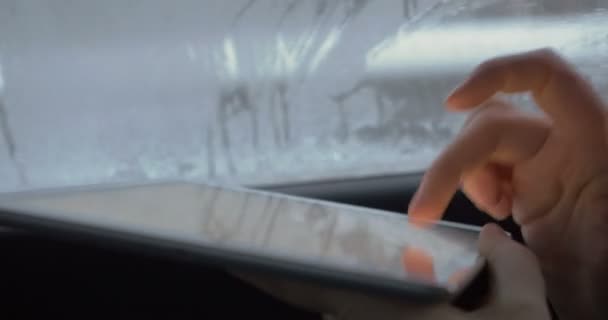 Woman typing on tablet computer in the car — Stock videók