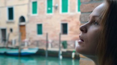 Woman with sad look outdoor in Venice