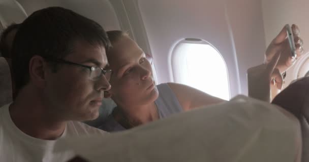 Couple Taking Selfie in the Plane — Stock Video