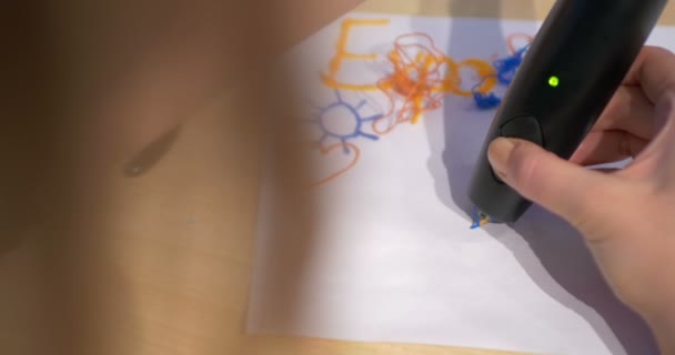 Woman drawing on paper with 3D pen — Stok video