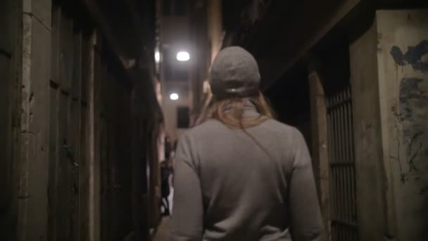 Woman Walking Along the Narrow Street — Stockvideo