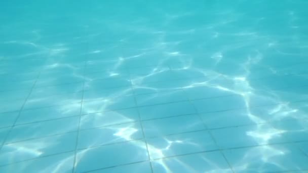 Pool floor with waving shiny water — Stock Video