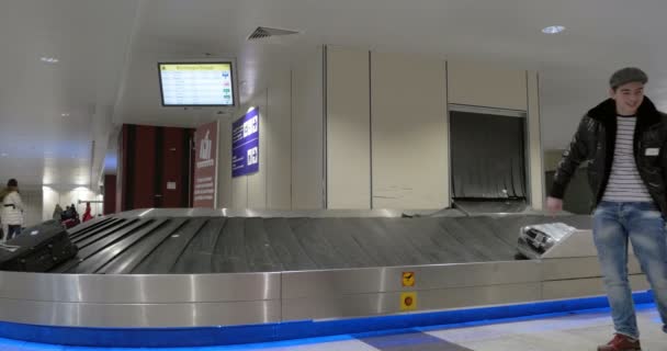 People in baggage claim area of airport — Stock Video