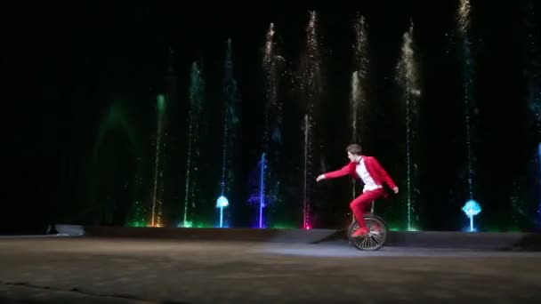 Male Circus Artist Riding a Monocycle during Performance — Stock Video