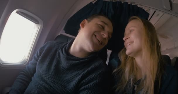 Young loving couple in the plane — Stock Video