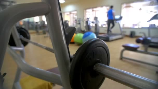 Bench press exerciser in modern gym — Stock Video