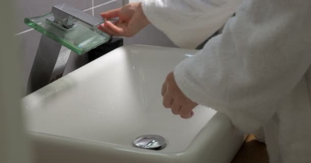 Woman washing hands with soap in the bathroom — Stock Video