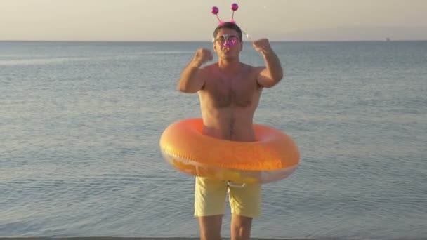 Young man having fun during New Year celebration — Αρχείο Βίντεο