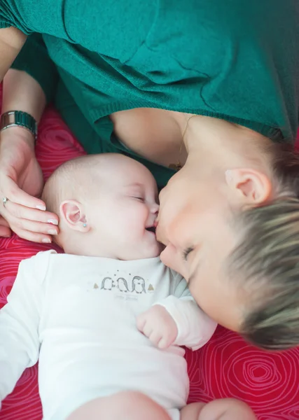 Mum gently kisses her daughter — Stock Photo, Image