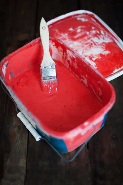 Red paint in a bucket — Stock Photo, Image