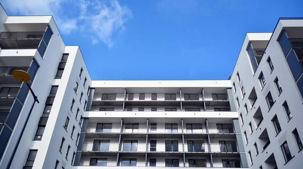 Cityscape with facade of a modern residential building. Modern European residential apartment building.